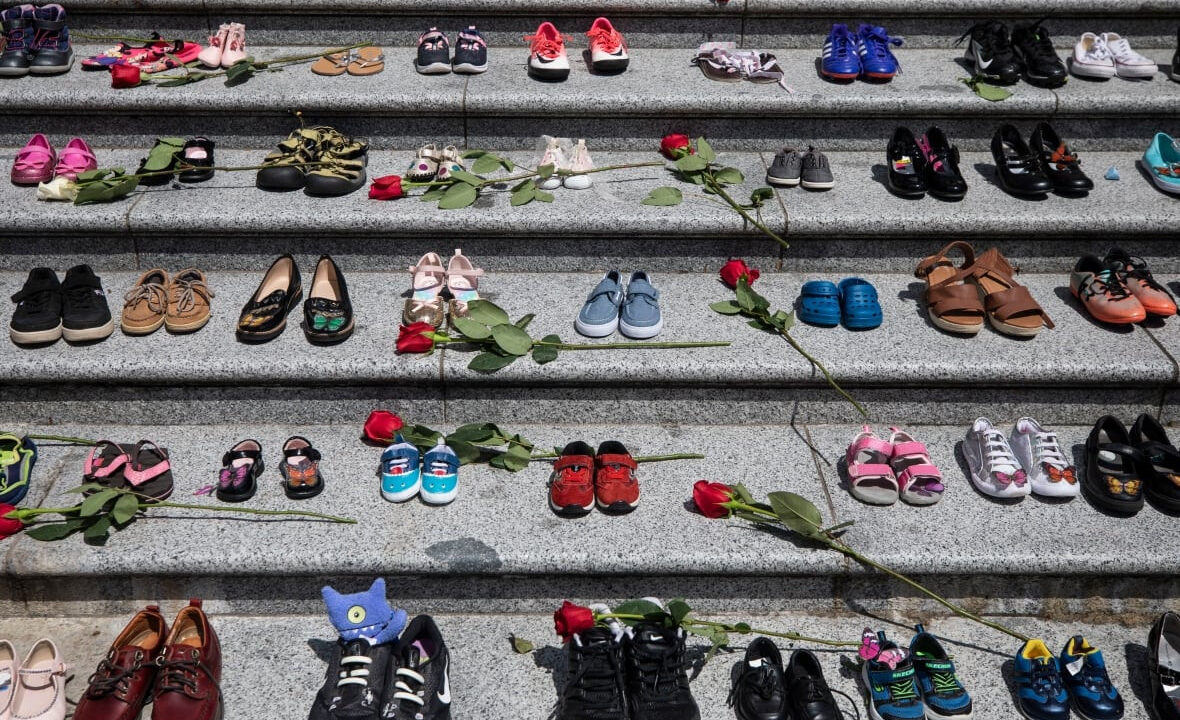 Image of children's shoes placed on the steps of the Vancouver Art Gallery as a memorial to the 215 children whose remains were found at a residential school in Kamloops.